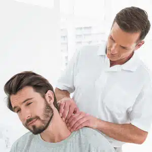 Chiropractor performing gentle manual adjustment, showcasing chiropractic for neck pain care approach.