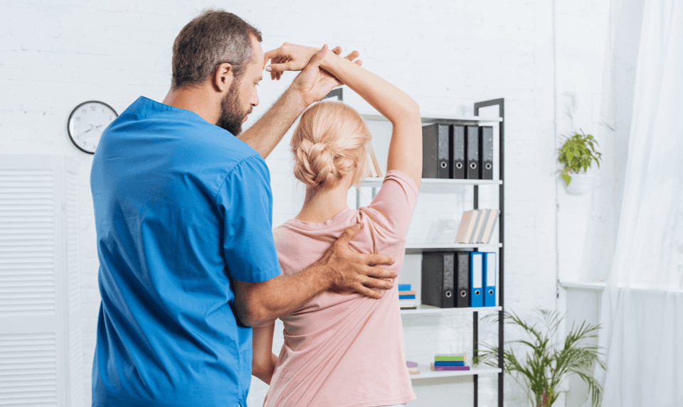 chiropractors working with a patient